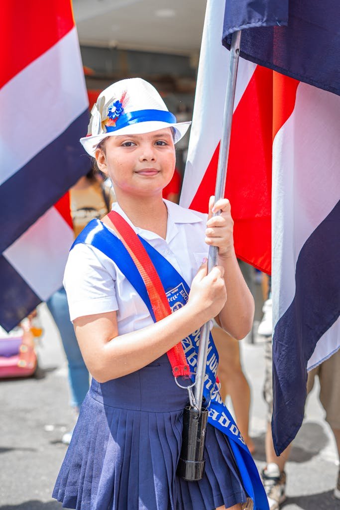 Schoolgirl in Holding the Flag of Costa Rica